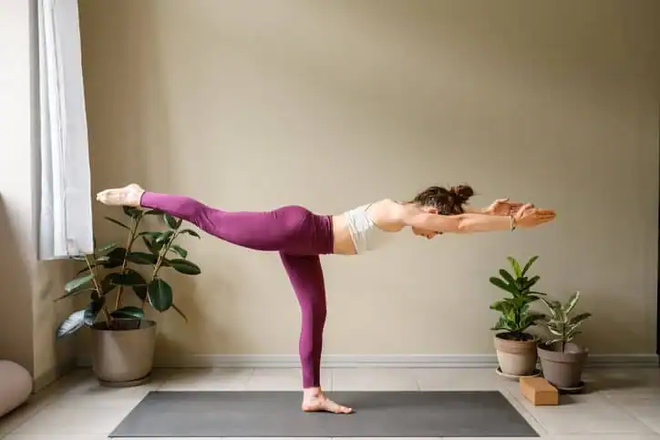 Achieving the Perfect Tone: How Often Should You Exercise for Results? 1 Woman doing Yoga exercise Rickmansworth to help with toning the body.